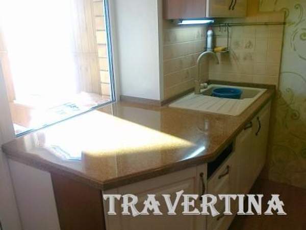 Мойка влитая в столешницу, искусственный камень