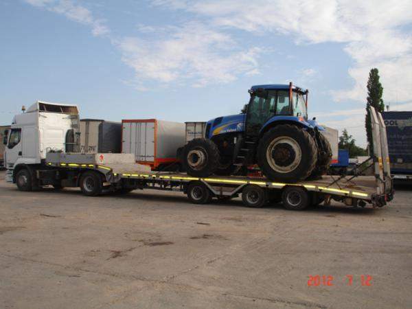 Перевести экскаватор каток вагончик гараж комбаин